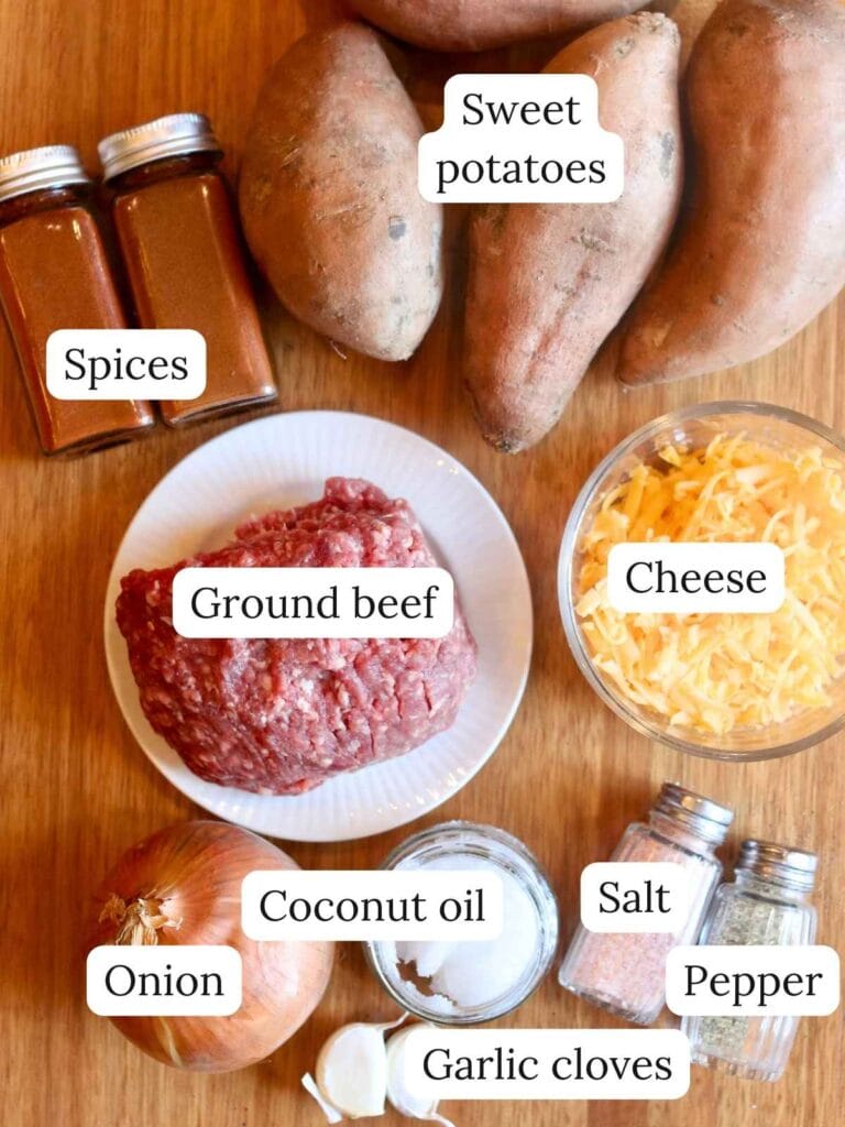 Ingredients for sweet potato and ground beef including sweet potatoes, ground beef, cheese, and onion.