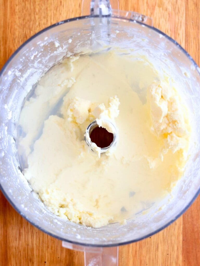 Final rinse of freshly blended homemade butter in a food processor bowl.