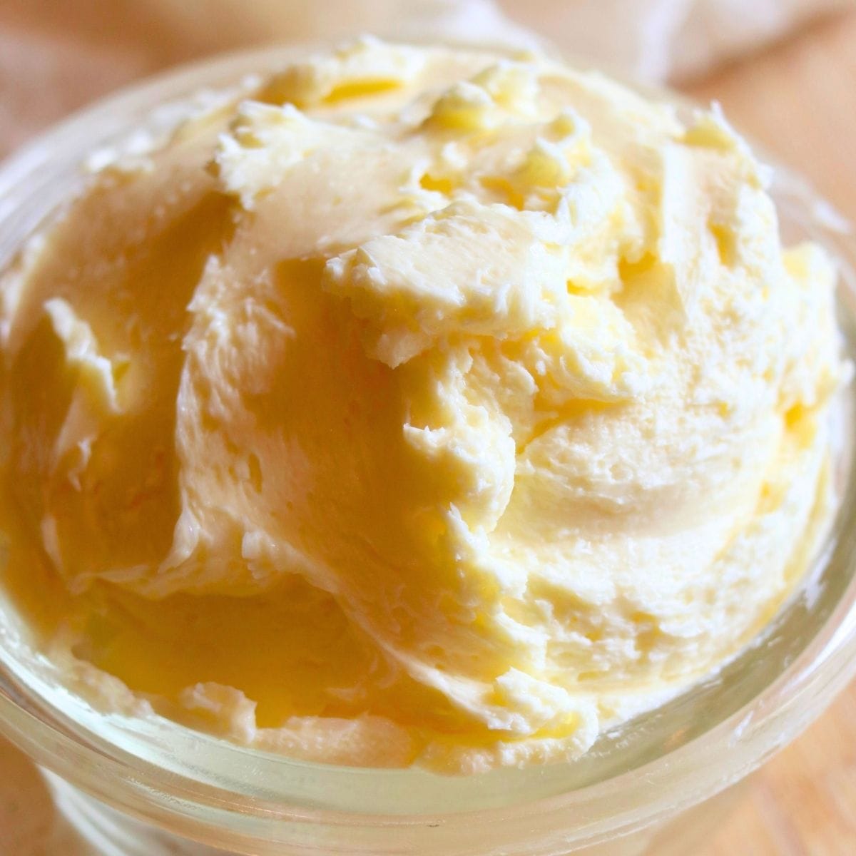 Homemade raw milk butter in a glass jar – creamy, organic, and freshly churned dairy product.