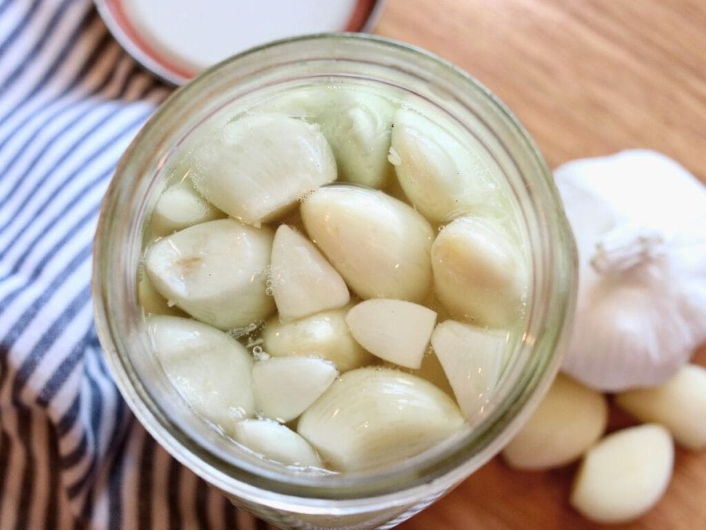 Open jar of fermented garlic.