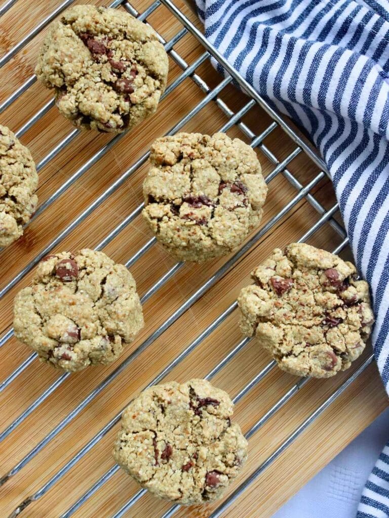 Oat flour chocolate chip cookies on a cooling rack.