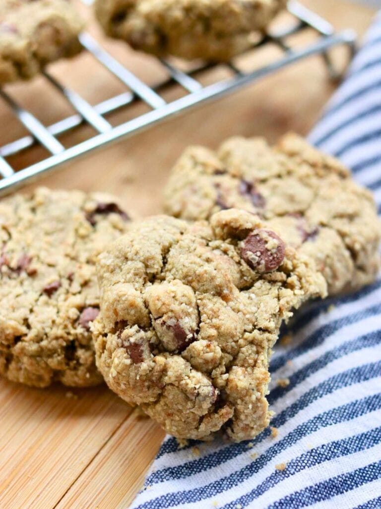 Oat flour chocolate chip cookie with a bite taken out of it.