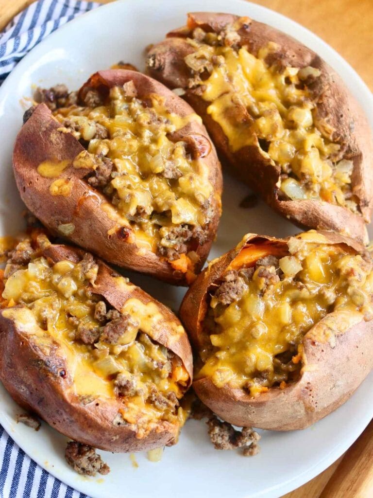 4 sweet potatoes and ground beef covered with melted cheese.