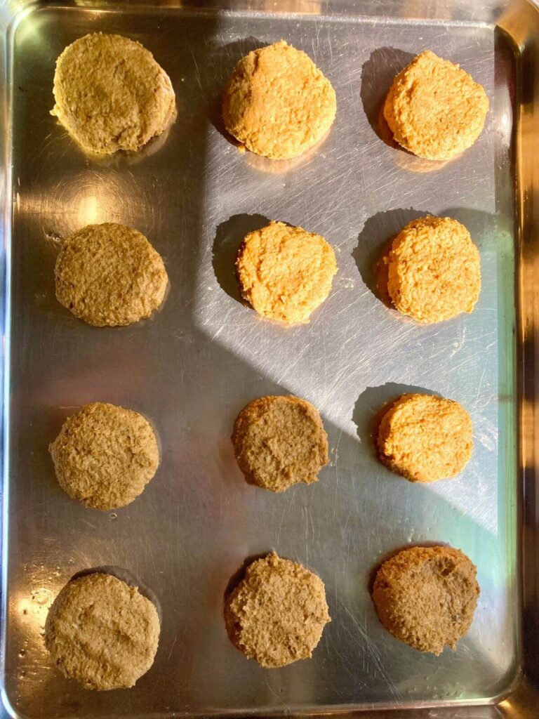 Unbaked gluten-free pumpkin cookies on a baking sheet.