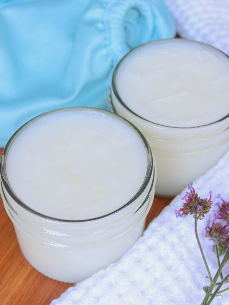 Closeup of two jars of baby balm.