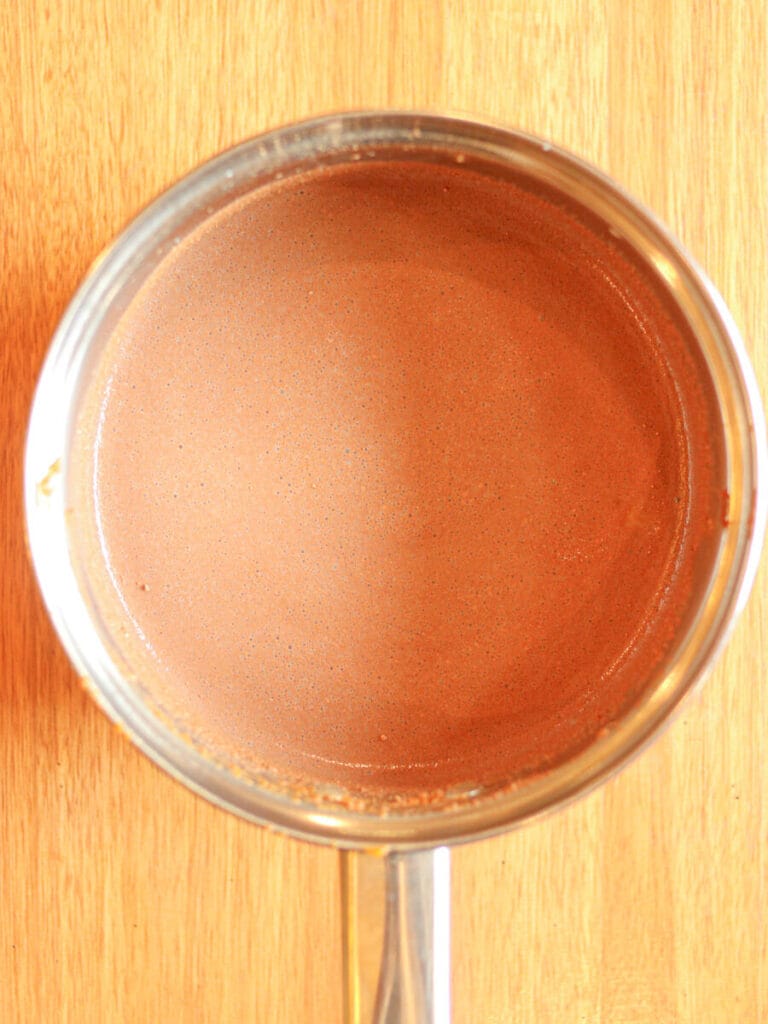 Ingredients for hot chocolate in a saucepan.