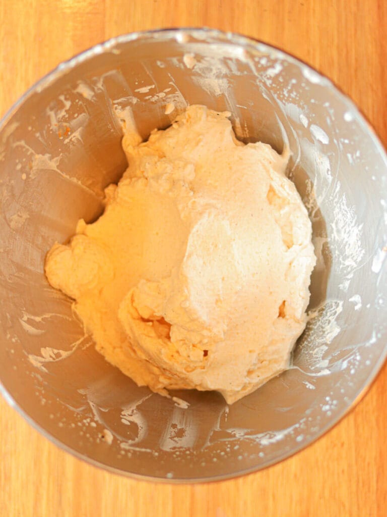 Bowl full of pumpkin spice whipped cream just after whipping.