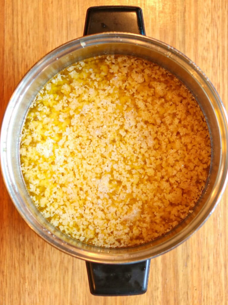 Melted beef suet in a stockpot.