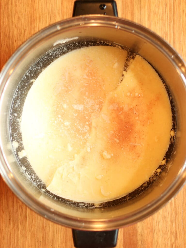 Hardened tallow in a stockpot with water and salt.