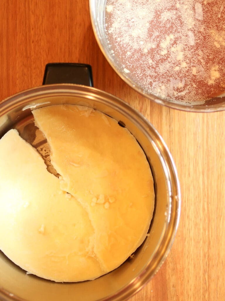 Removing hardened tallow from dirty water.