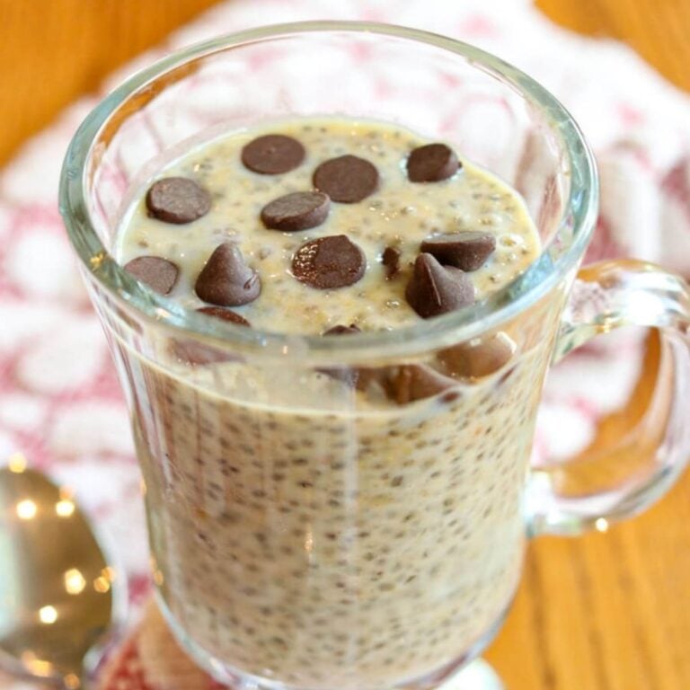 Close up view of high protein chia seed pudding topped with chocolate chips in a serving glass.